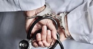 HPCSA ups the battle against bogus medical practitioners Female Doctor or Nurse In Handcuffs and Lab Coat Holding Stethoscope.