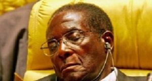 Outrage over 'disinterested' Mugabe's WHO appointment justified — columnist Zimbabwe's President Mugabe closes his eyes during Africa Union meeting in Sirte, Libya.