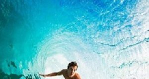 Regular surfers more likely to carry antibiotic resistant E. coli Surfer on Blue Ocean Wave in the Tube Getting Barreled