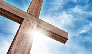 Wooden Cross with a Bright Blue Sky and Sun