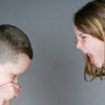 Older girl yelling at younger boy