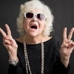 Cool grandmother showing peace sign