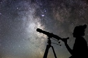 Woman and night sky. Watching the stars Woman with telescope.