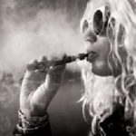 Black and white picture of woman smoking e-cigarette