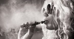 Many vape-flavouring chemicals trigger inflammation Black and white picture of woman smoking e-cigarette