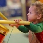 The kid drumming in the amusement park