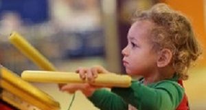Learning music enhances cognitive abilities in children The kid drumming in the amusement park