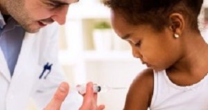 Pertussis resurgence: Incomplete coverage and vaccination 'hesitancy' Doctor pediatrician injecting vaccine to cute african girl