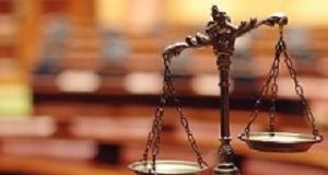 Proposed 'pay as you go' compensation system badly flawed, argue experts Symbol of law and justice in the empty courtroom, law and justice concept.