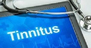 'Significant' success with new treatment for tinnitus Tablet with the diagnosis tinnitus on the display