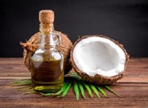 Coconut and coconut oil on wooden table