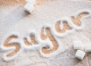 Inscription sugar made into pile of white granulated sugar