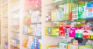 Many OTC diet supplements contain potentially harmful drugs Medicines on pharmacy store shelves blurred background