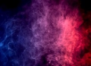 Colorful  purple and blue smoke clouds on dark background