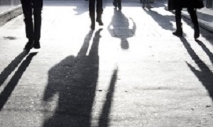 Blurry shadows of people oin the city sidewalk