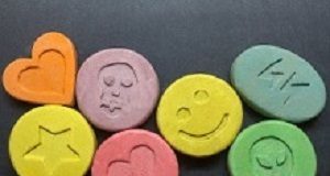 Study finds that 'ecstasy' could help with PTSD treatment Ecstasy tablets on black background