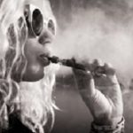 Black and white picture of woman smoking e-cigarette