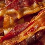 Crispy Organic Unhealthy Bacon on a Background