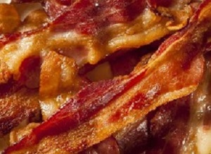 Crispy Organic Unhealthy Bacon on a Background