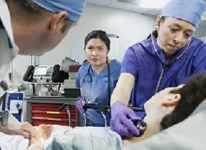 Patient and doctors in the emergency room