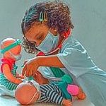 A little girl playing the doctor