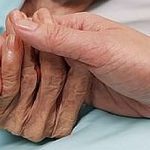 Holding grandmother's hand in the nursing care. Showing all love, empathy, helping and encouragement : healthcare in end of life and palliative concept