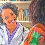Laughing african american female doctor with patient