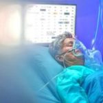 Infected patient in quarantine lying in bed in hospital, coronavirus concept.