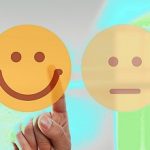 hand is selecting a happy mood smiley