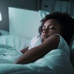 Woman sleeping in her bed