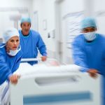 Doctors rushing patient to surgery