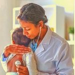 Doctor controlling the health of baby