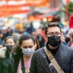 People wearing a face masks to protecting themself because of epidemic in China. Selective Focus. Concept of coronavirus quarantine.