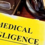 Medical Negligence form, documents and gavel on a table.