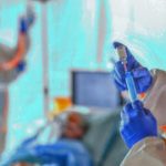 Doctors looking after infected patients in hospital, coronavirus concept.