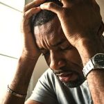 Black guy stressing and headache