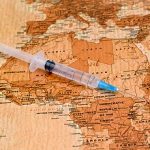 syringe on a map of africa