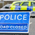 10-MB-Harm Reduction-12-08-2021-Police-Road block-Road closed-Car-iStock-1218431622