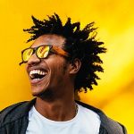 13-MB-Research Africa-12-08-2021-Black-Man-SA-Africa-Happy-Yellow-Phone-iStock-890698790