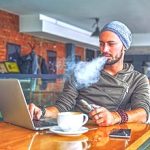 10-MB-Harm Reduction-09-09-2021-1-Vape-Vaping-e-cigarette-Work-laptop-iStock-904351660