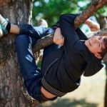 3-MB-Focus-16-09-2021-Teen-Boy-Play-Tree-iStock-1254212625