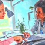 2-MB-Focus-25-11-2021-2-Doctor-Patient-Consult-iStock-1171723505