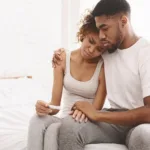 Black couple with a negative pregnancy test result