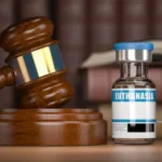 Euthanasia concept. Gavel as a symbol of legal system vith vial and syringe.