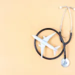 medical tourism concept airplane and stethoscope