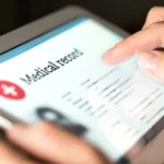 Electronic medical record with patient data and health care information in tablet. Doctor using digital smart device to read report online.