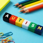 Autism and education concept. Autism spectrum disorder. The word autism on colorful cubes